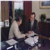 Vice President Bush and President Reagan working in the Oval Office