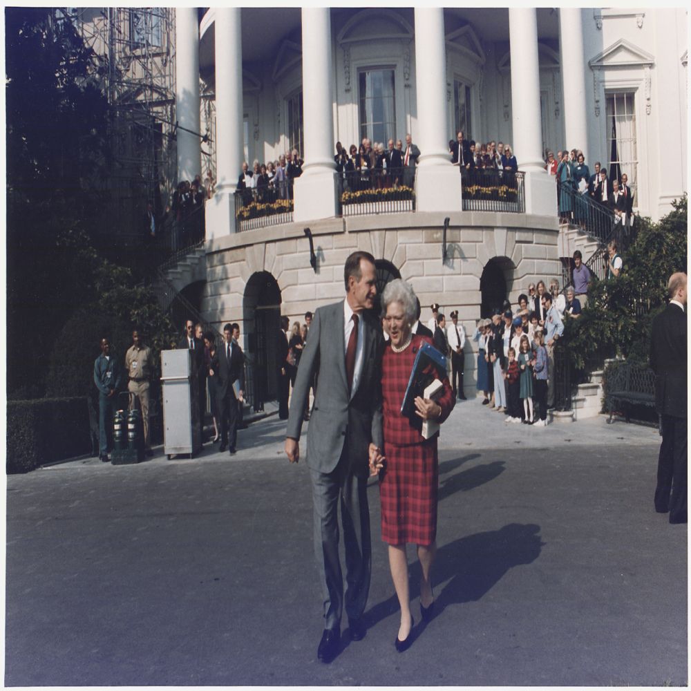 President and Mrs. Bush walk towards Marine One to leave for Camp David