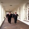 President Ronald Reagan and Vice President George Bush walk along the West Wing Colonnade