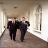 President Ronald Reagan and Vice President George Bush walk along the West Wing Colonnade